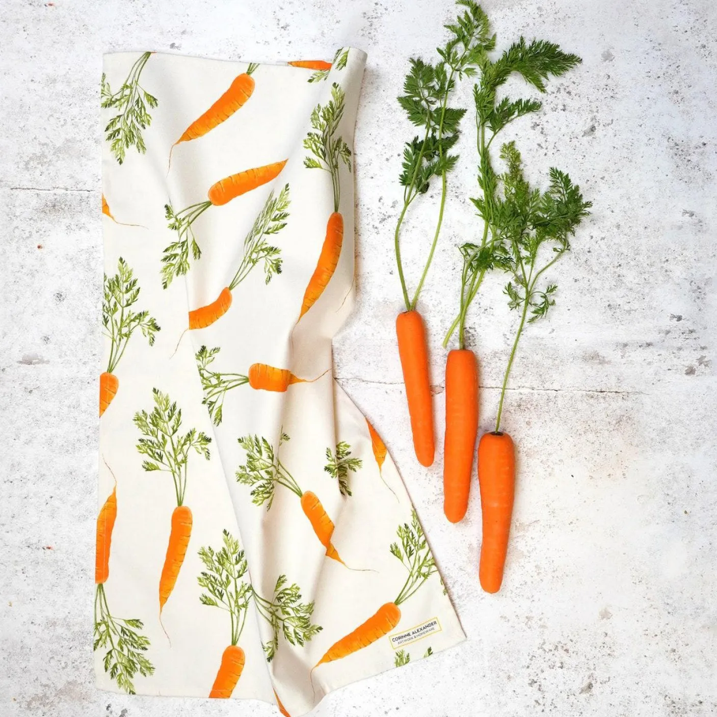 Carrot Tea Towel by Corinne Alexander