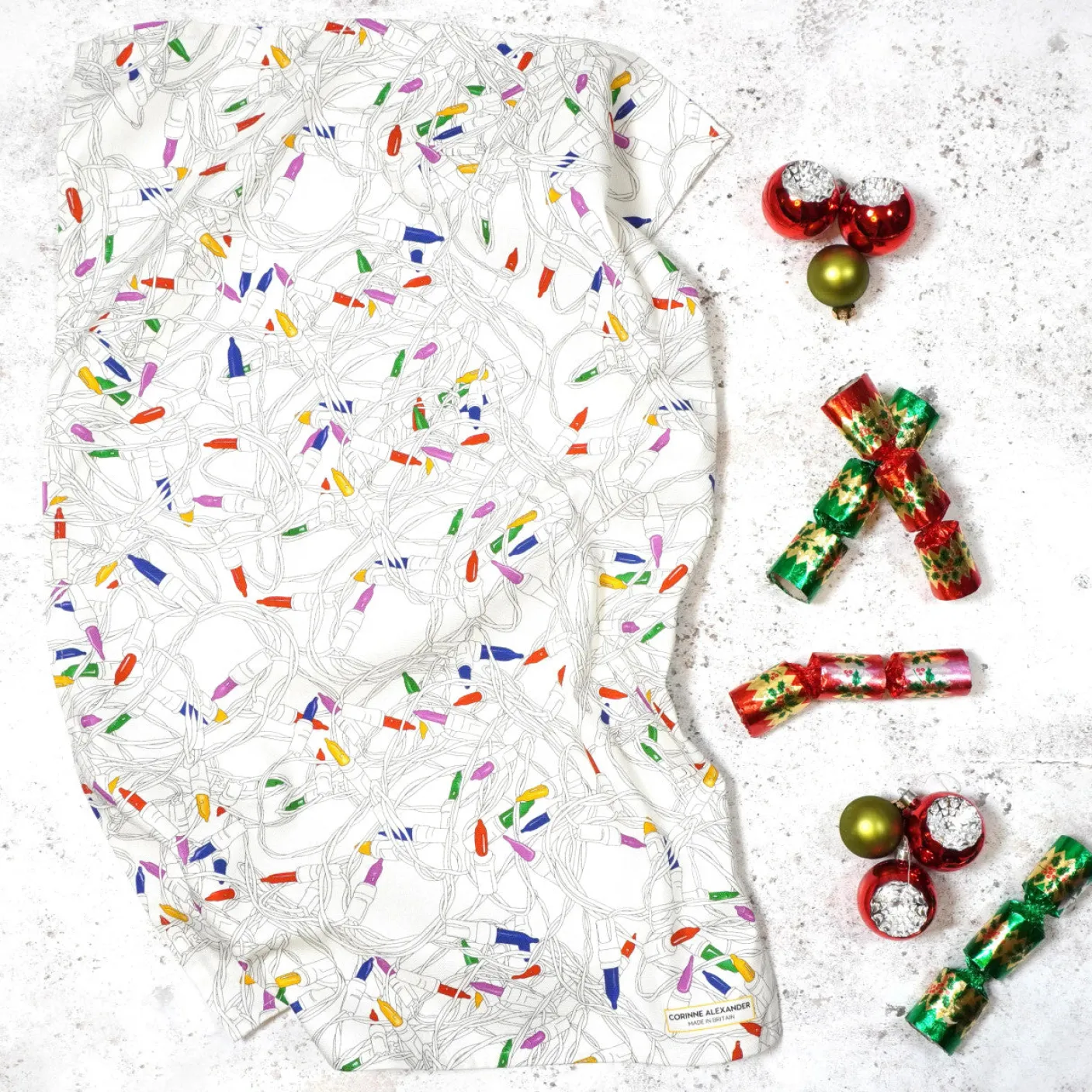 Christmas Lights Tea Towel by Corinne Alexander
